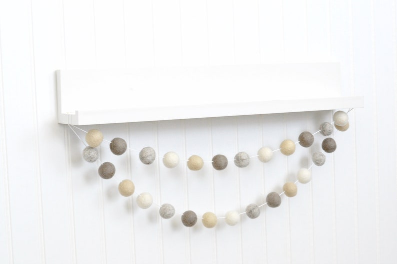 string of gray tan brown and white balls