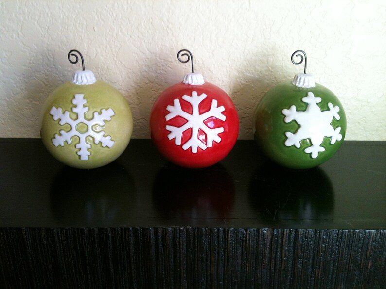 yellow red and green ornaments with snowflakes