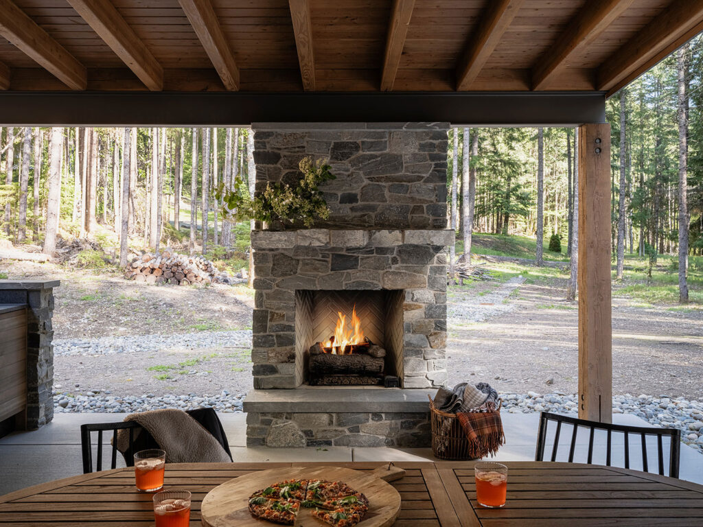 Outdoor Fireplace in Mt Rainier Vacation Home by White Label Interiors