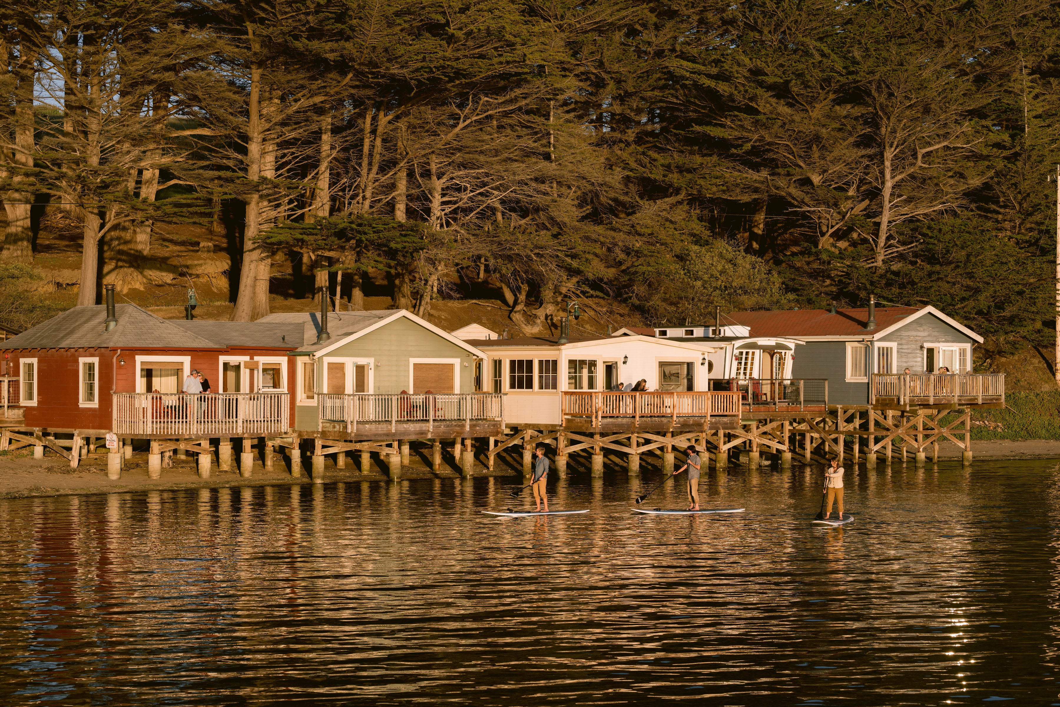 paddleboarding-in-front-of-cottages-credit-kristen-loken