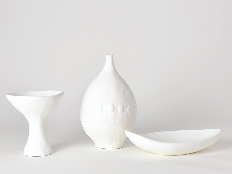 Perigold Plaster table vase shown with decorative bowl and cup