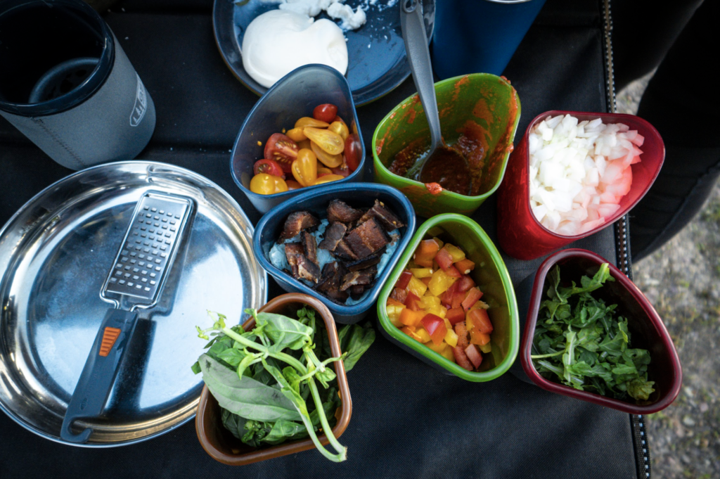pinnacle camper cookset full of ingredients with grater