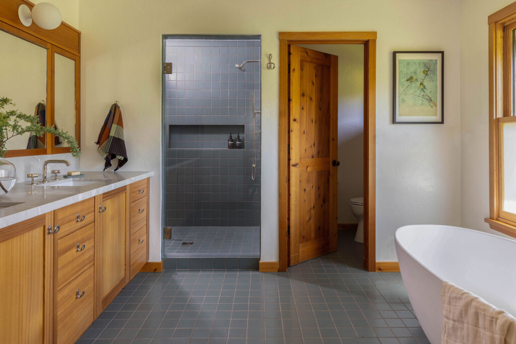 Primary Bathroom in West Marin House by Decorotation