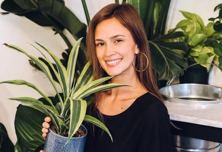 Woman holding plant