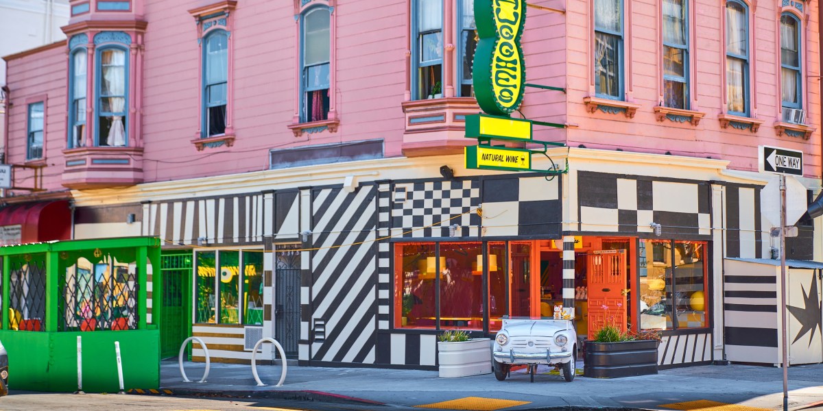 The exterior of a color restaurant featuring geometric patterns and a green and yellow sign with the name "Shuggie's" on it.