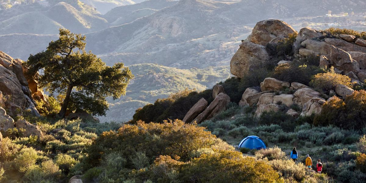 Cover Image with Campers and Tent