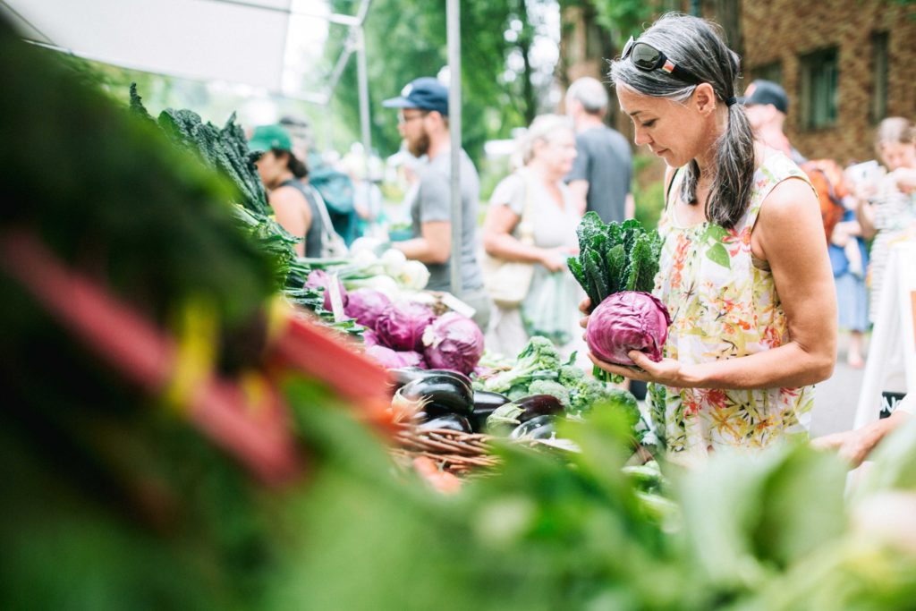 Woman with a Cabbage at a Farmers Market