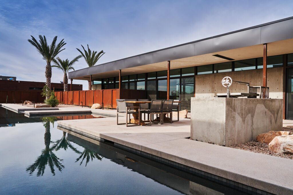 Outdoor Dining with Roof Overhanging Pool