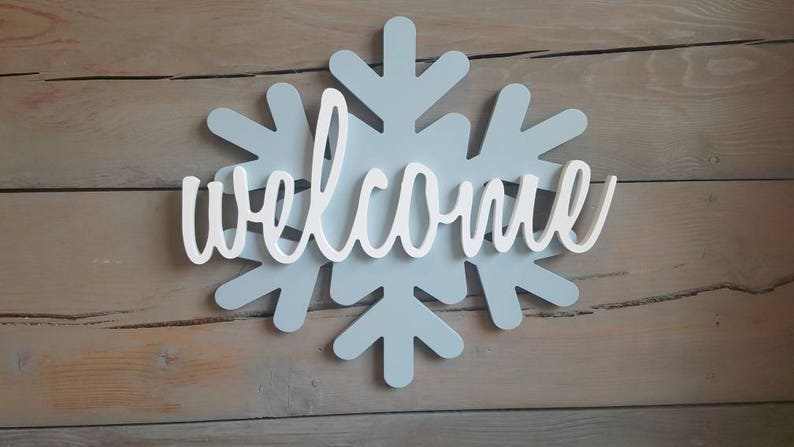wooden snowflake with script welcome