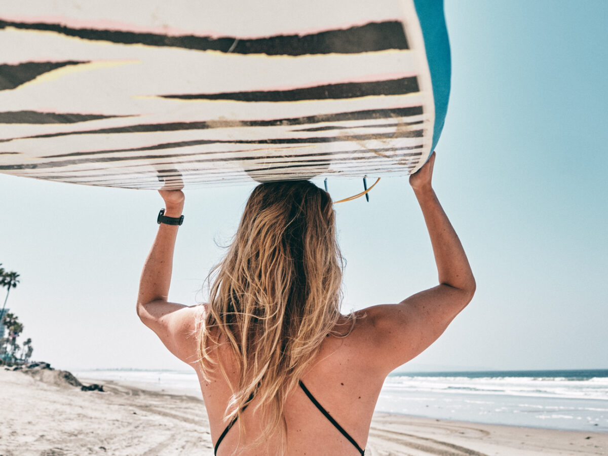 Krista Simmons with a Surf Board