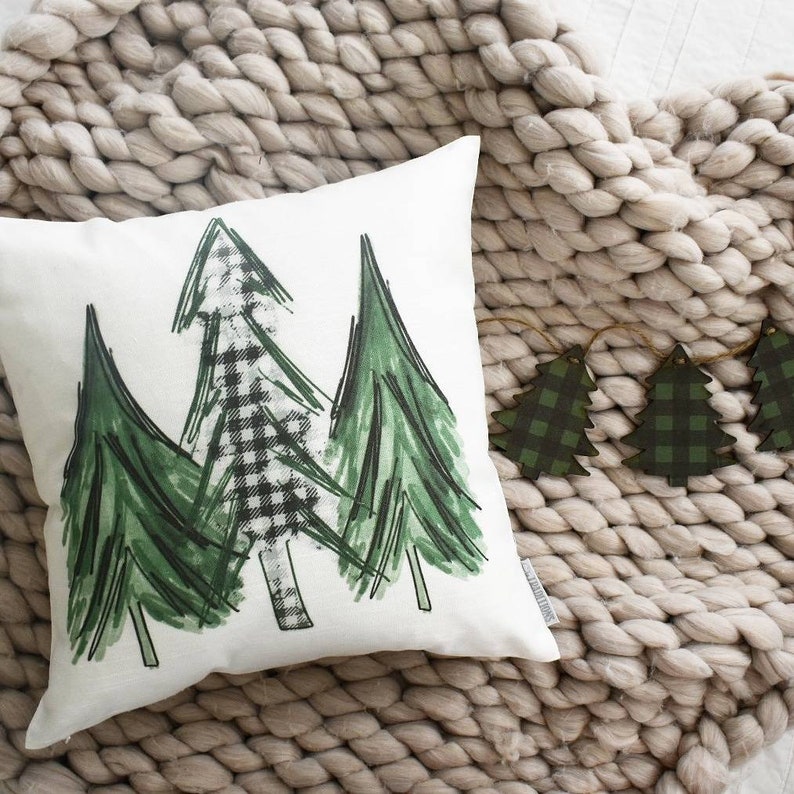 pillow cover with two green trees and one plaid tree