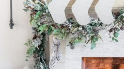 personalized white stockings hanging from mantle