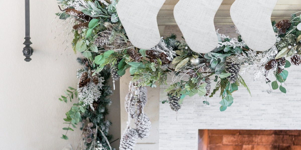 personalized white stockings hanging from mantle