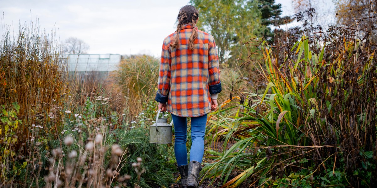 Woman in a Garden with a Watering Can