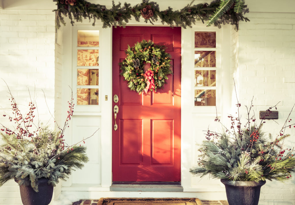 Exterior Red Door Decorated with a Wreath for Christmas